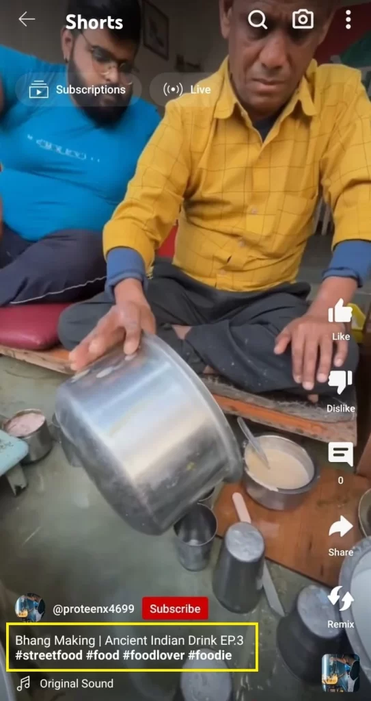 The man is mixing cow dung with milk, but is mixing bhang paste in milk.
